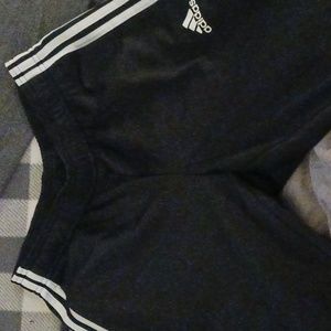 Adidas joggers black with white stripe and cuff at bottom.of.leg
